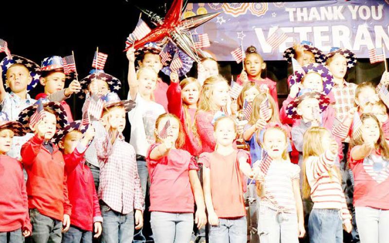 Second grade students from Shelbyville ISD’s S.W. Carter Elementary School perform during the Veteran’s Day program the school held to honor area veterans Tuesday, Nov. 11. Submitted | Light and Champion
