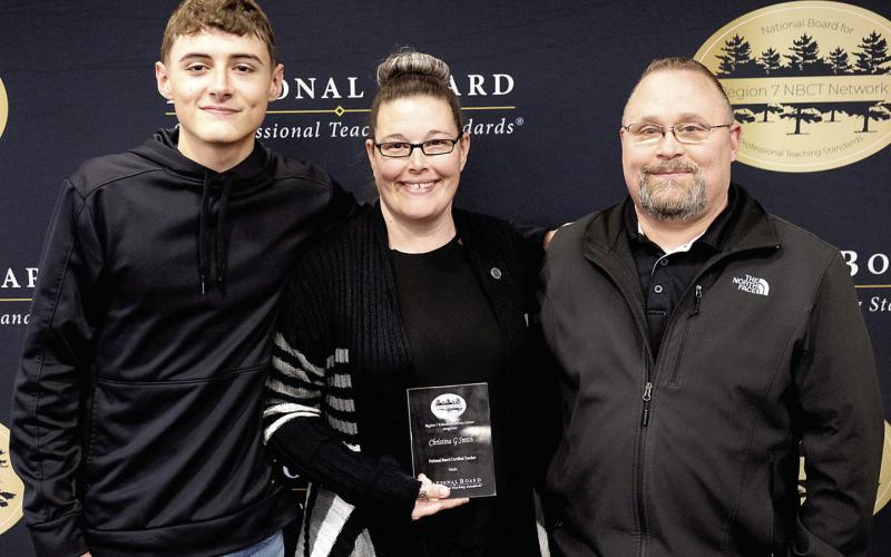 Christina Smith with her husband, Chris Smith, and their son, Ayden Smith, after being recognized as a National Board Certified Teacher. Submitted | Light and Champion