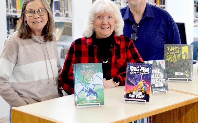 Fannie Brown Booth Memorial Library staff Shawn Lowater (left) and Sandra and Roy Davis are excited to once again be able to serve the library’s patrons after its recent refurbishment. David Danley | Light and Champion
