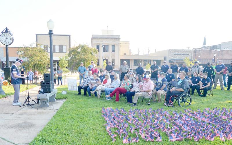 Larry Hume, VFW Post 8904 Adjutant, addresses the gathered crowd at the memorial ceremony held in honor of Patriot Day. During the ceremony, first responders and law enforcement personnel spoke in memory and honor of those who have served and died in the line of duty in service to their country. David Danley | Light and Champion