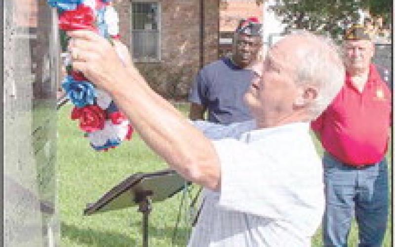 John Piersol, Jr. places the VFW Memorial Wreath in honor of his father and all Korean War veterans at the VFW Post 8904 observance of veterans who served in the Korean War. (Submitted photo)