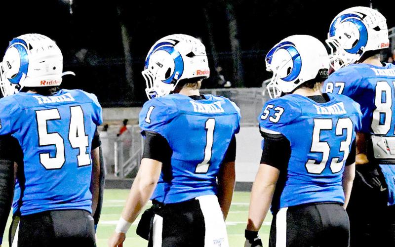 Joaquin Ram team captains Karson Rogers (54),Trenton Runnels (1), Aiden Kilpatrick (53) and Connor Rios (87) line up for the coin toss to begin their Regional playoff game against the San Augustine Wolves. KELSI WOOD JHS | LIGHTAND CHAMPION