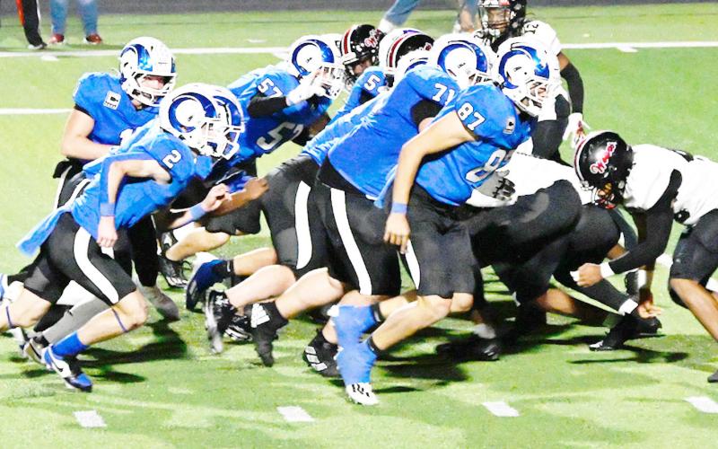 Cooper Bragg (2) and Connor Rios (87) prepare to lead the way for Trenton Runnels (1) around the edge while the Ram offensive line ties up the Wolves defenders. KELSI WOOD JHS | LIGHT AND CHAMPION