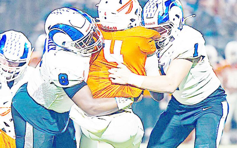 Joaquin’s Londell Parker (8) and Trenton Runnels (1) team up to take down a Honey Grove runner in action during the Ram’s 41-8 statement win over the Warriors in last Friday’s Area Championship game. Lister Publishing | Light and Champion