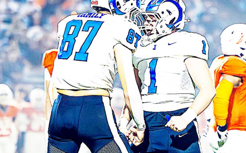Conner Rios (87) and Trenton Runnels (1) hype each other up after making a tackle in the Rams’ commanding win over the Warriors of Honey Grove. Lister Publishing | Light and Champion