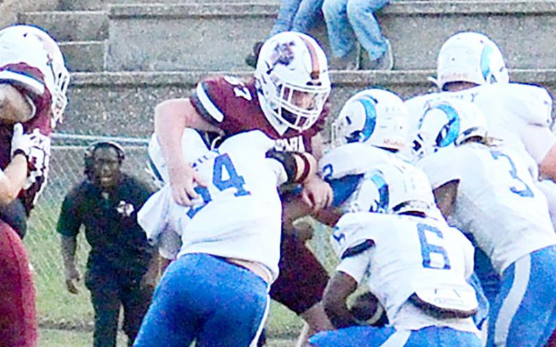 Amarion Wilson, no. 6, makes a cut toward the hole as the Ram offensive opens up a running lane for him. Kelsi Wood | JHS