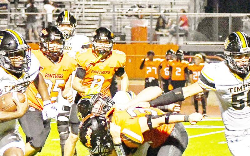 Timpson Running back Jeffrey Richardson heads upfield while lineman Dillon Wilkie looks to clear the way for him in action against Palestine Westwood. Aylee Crow | Timpson Student Media Intern