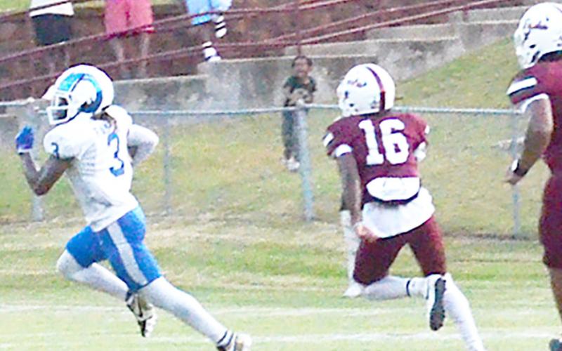 Ram Jacob Gatlyn streaks toward the end zone with a couple of Tigers in hot pursuit. Kelsi Wood | JHS