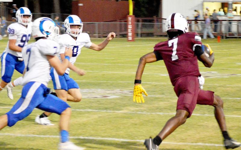 Tenaha Tiger Jataivius Malone turns the corner while three Joaquin Ram defenders hustle to cut him off. David Danley | Light and Champion