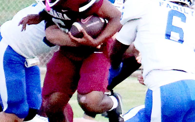 Kori Miles powers through a tackle up the middle in last week’s game against the Joaquin Rams. Zakary Hartley | Tiger Media
