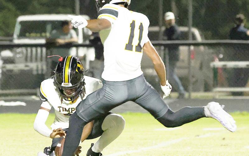 Alexis Castillo of Timpson plants to attempt a kick in the Bears’ game against the Hemphill Hornets last Friday night. Kristan Solomon | THS