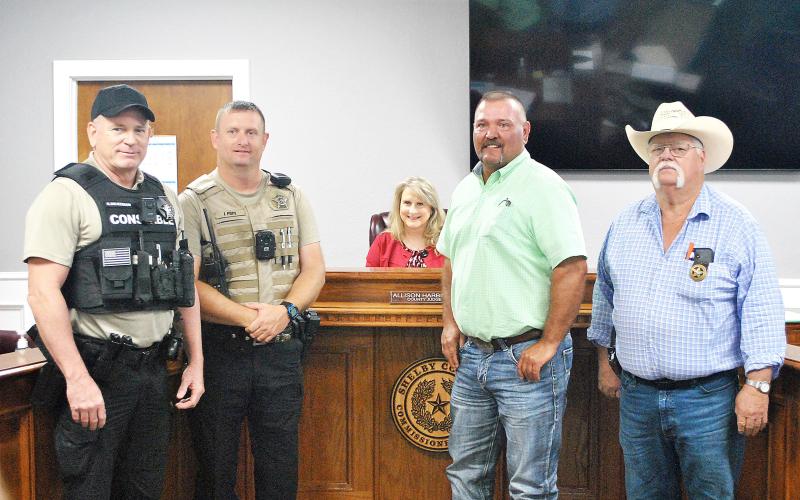 Rowdy Green (second from right) was sworn in as Constable Pct. 4 by Shelby County Judge Allison Harbison to fill an unexpired term during last week’s commissioners court meeting. Green has been a employee of the Pct. 4 commissioner for several years. Also at the ceremony were (from left) new Pct. 5 Deputy Const. Glen Dickerson, Pct. 5 Const. John Pope and Pct. 3 Const. Roy Cheatwood. Lisa White | Light and Champion