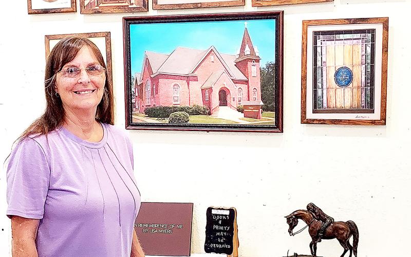 Myers has created a book memorializing Center’s First Christian Church as a labor of love after having grown up in the church and experiencing many passages of life there. David Danley | Light and Champion