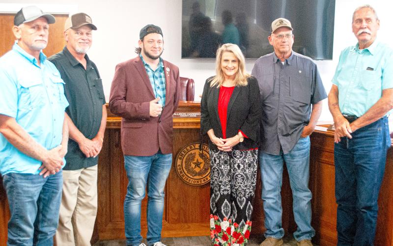 Mark Dickson (center) joins County Judge Allison Harbison and commissioners (from left) Shannon Metcalf, Roscoe McSwain, Stevie Smith and Tom Bellmyer in declaring Shelby County as a Sanctuary County For The Unborn at the July 30 commissioners court meeting. Zack Clark | Light and Champion