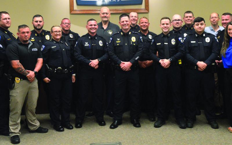 Ricky King (front row, center) was sworn in as the new Center Police Department Chief yesterday. King started his career as a patrolman before serving as a detective and eventually rising to be assistant chief. King will be taking over for retiring Chief Jim Albers (back row, center). David Danley | Light and Champion