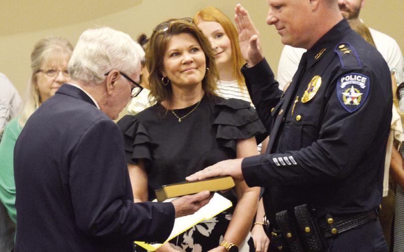 Ricky King is sworn in as Center Police Department’s new chief on Monday by Municipal Judge Grover Russell as his wife, Denny King, looks on. David Danley | Light and Champion