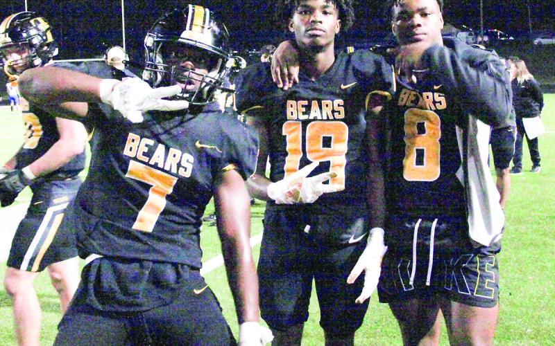 Nate Scourton, Braylon Parker, and J.J. Garner ham it up on the sideline at Timpson’s Friday night match against the Wolfe City Wolves. Leon Aldridge photo/The Light and Champion