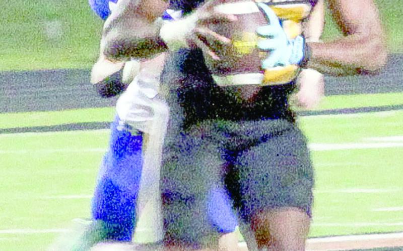 Bears quarterback Terry Bussey looks for a receiver. The connection was made when Bussey hit junior wide receiver Colton Carrol on a 43-yard touchdown pass. Leon Aldridge photo/The Light and Champion