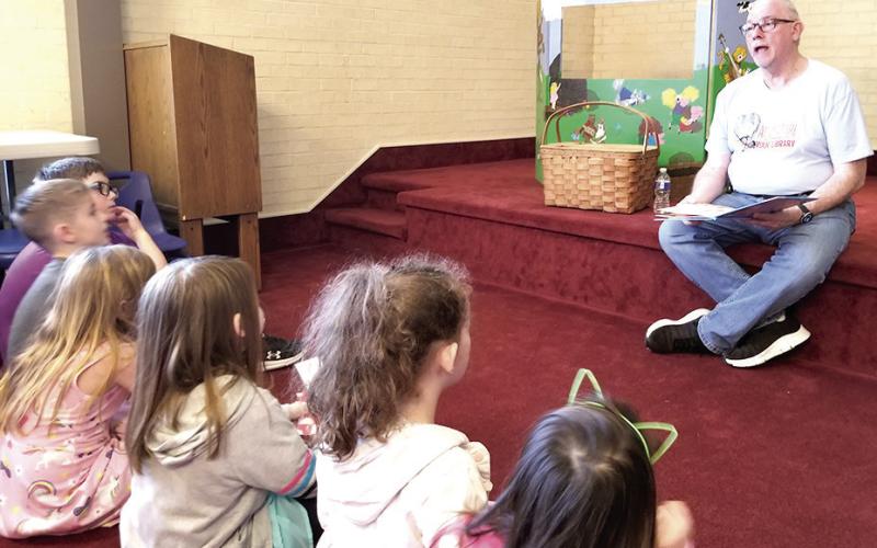 Mr. Roy reading to the kiddos that attended the first annual Take Your Child to the Library Day” at the Fannie Brown Booth Memorial Library. Submitted Photo