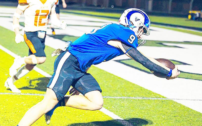 Jadyn Brown reaches for the goal line on one of the Rams’ many touchdown runs against the Elysian Fields Yellowjackets in their Regional playoff game last Friday night. Lister Publishing | Light and Champion