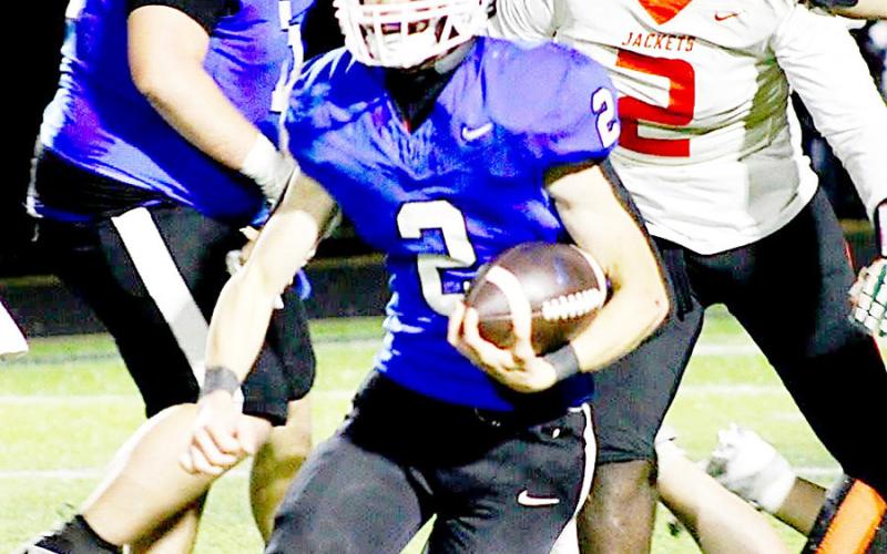 Cooper Bragg of the Joaquin Rams makes a cut as he heads upfield against the Elysian Fields Yellowjackets in the Regional round of the state championship playoffs. Bragg contributed 262 of the Rams’ total of 596 yards on the ground. Savannah Jordan JHS | Light and Champion
