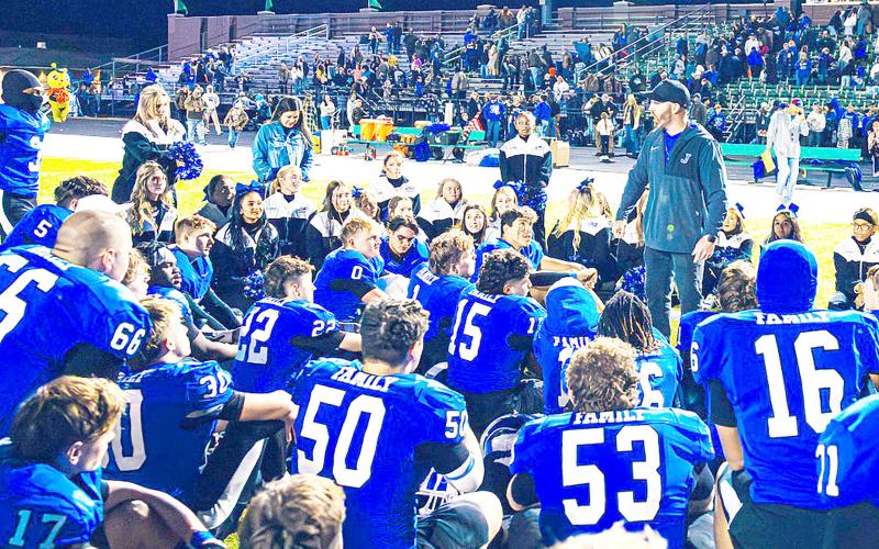 Coach Jared Jones speaks to his team last Friday night at the Rams playoff game against Elysian Fields. The Rams continued their remarkable postseason run with a 74-21 win over the Yellowjackets. Lister Publishing | Light and Champion