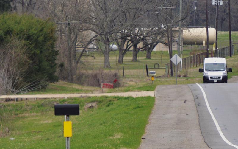 McBride Operating has already poured two concrete driveway entrances in anticipation of its application for a permit to locate an oilfield solid waste disposal site on Highway 84 in the Paxton Community being approved. Two of Paxton Water Supply’s wells are seen in the background, only 1200 feet away. David Danley | Light and Champion