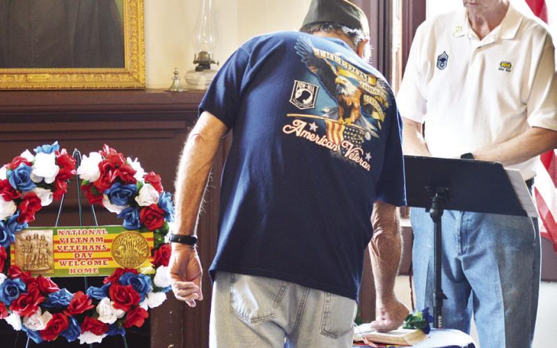 Members of the VFW Post 8904 pay honor to veterans of the Viet Nam War including many local service members who lost their lives in the conflict at a ceremony held in the historic Shelby County courthouse. Zack Clark | Light and Champion