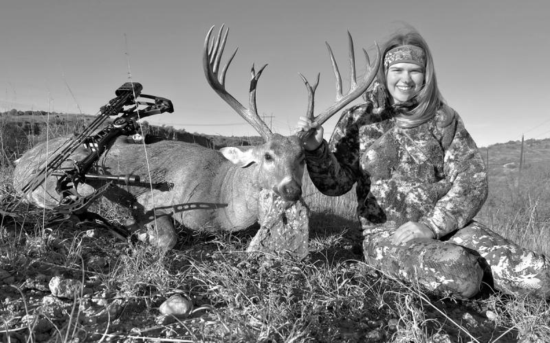 Lady archer Hailey Holder with the 7 1/2-year old buck she arrowed in Collingsworth County in the Texas Panhandle on October 14. Holder reported on the Texas Buck Registry that hunters had purposely avoided shooting the deer for the last four seasons to allow it to mature. (Photo courtesy Texas Buck Registry)