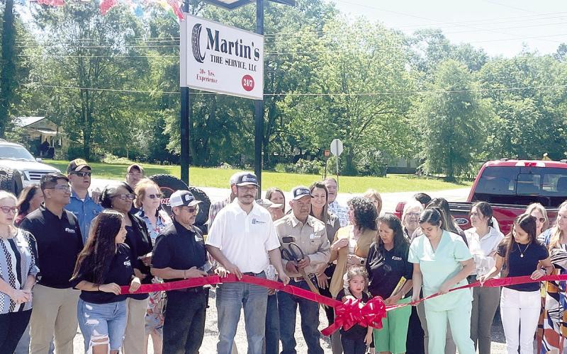Family and well-wishers gathered to help Martin Cervantes celebrate the opening of his new tire shop on Highway 87 North in Center on Monday. Zack Clark | Light and Champion