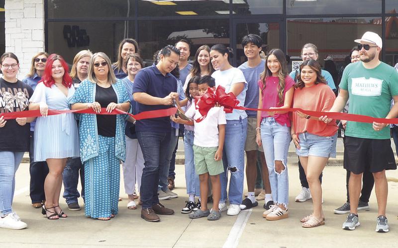 Bee Kahn, owner of Bee’s Nails, and his family were recently visited at his business by members of the Shelby County Chamber of Commerce and other community members to hold an official ribbon-cutting ceremony. Zack Clark | Light and Champion