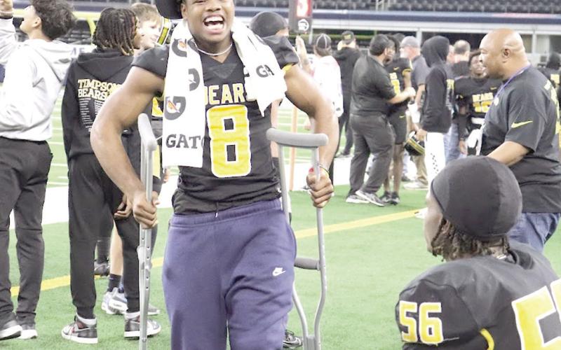 J.J. Garner, though injured operated the crutches with Joy as the Bears closed out the final moments of the game. Taylor Bragg | The Light and Champion