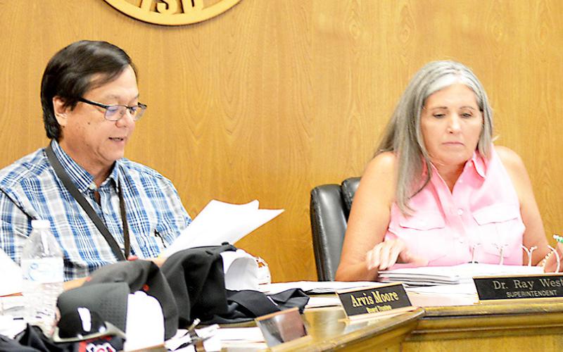Shelbyville ISD Board of Trustees President Etola Jones listens as Superintendent Ray West delivers his superintendent’s report to the board at its Aug. 11 meeting. David Danley | Light and Champion
