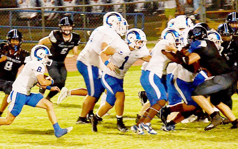 Ram Londell Parker looks for running room against a pack of Bulldog defenders in Joaquin’s 27-26 win over Corrigan-Camden last Friday night. Kelsi Wood | JHS