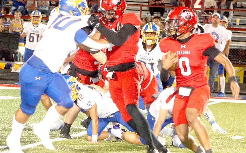 Ronnie Williams heads for the open field around the end in Shelbyville’s Homecoming game against the Carlisle Indians. The Dragon Yearbook