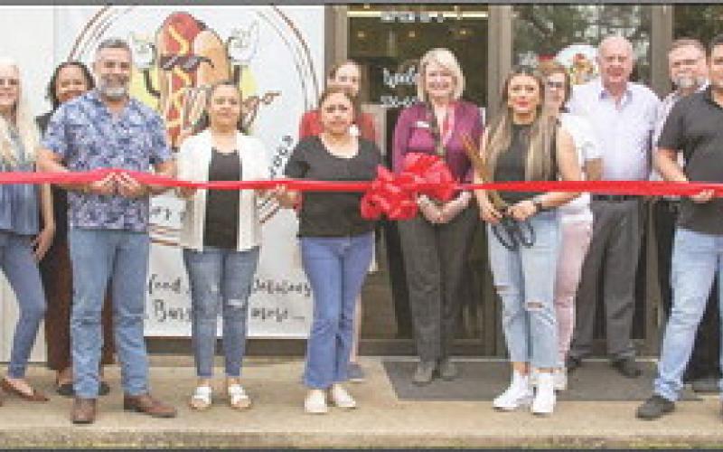 Ribbon cutting held at Mr. Doggo