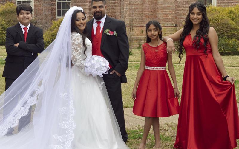 After 18 years of marriage, Agustin and Luisa Arriaga decided to renew their vows on their anniversary, Feb. 14. The couple were originally married by a justice of the peace, but this time chose to celebrate with a ceremony at the St. Therese Catholic Church in Center before capturing more memories of the day with a photoshoot on the historic courthouse square. Zack Clark | Light and Champion