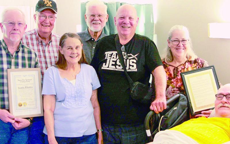 Presenting copies of resolutions honoring Timpson native Scotty Rhodes’ contributions to the preservation of Timpson history were (left to right) J.P. Tracy Broadway, Shannon Ramsey, Judy Ramsey, Tad Bailey, Paul Smith, and Timpson Mayor Debra Smith.