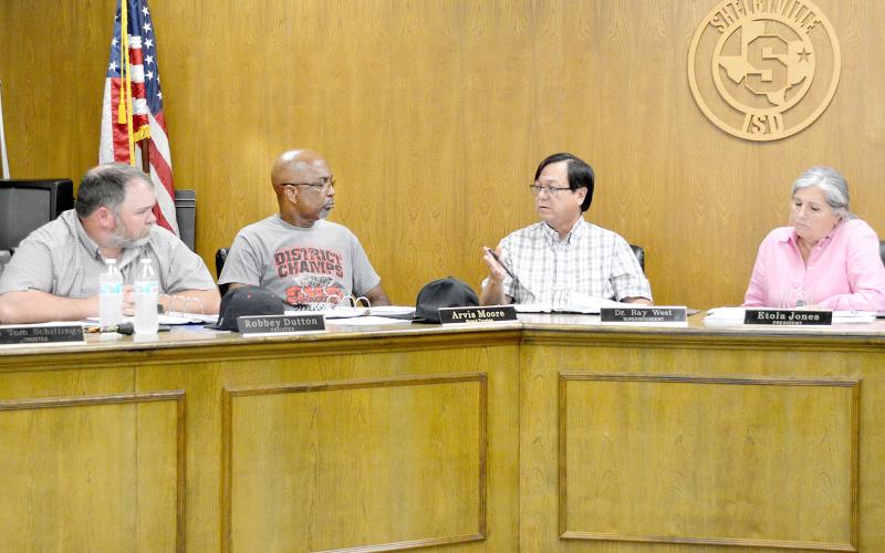 The Shelbyville ISD board of trustees listens as Superintendent Dr. Ray West explains a budget amendment that was needed to bring the district’s budget back into balance. David Danley | Light and Champion