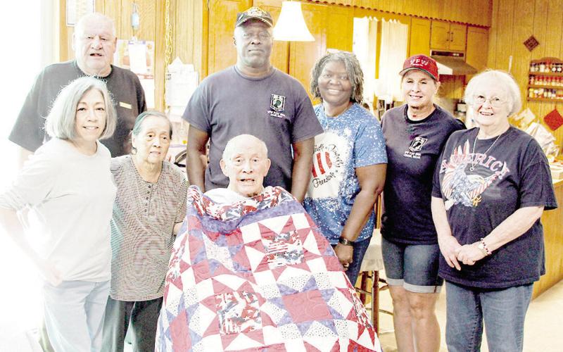 (left to right): Daughter Gloria, Post Commander Mike Wulf, wife Satchiko, Mr. Jack, Post Chaplain Richard Lundie, Auxiliary member Linda Lundie, Post Quartermaster Mary Roberts, and Auxiliary President Mary Fausett. Larry Hume | Light and Champion