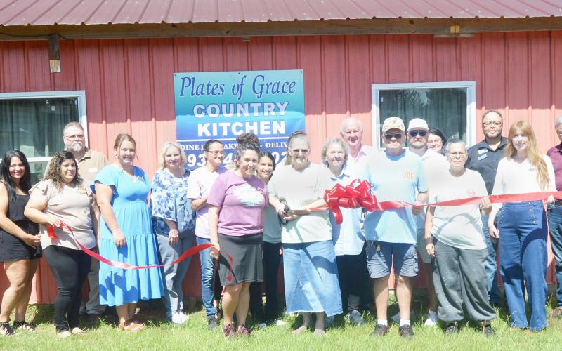 Terry Bridwell, owner of Plates of Grace, celebrates the opening of her new restaurant with the support of the Shelby County Chamber of Commerce, as well as many family members, friends and other supporters. David Danley | Light and Champion