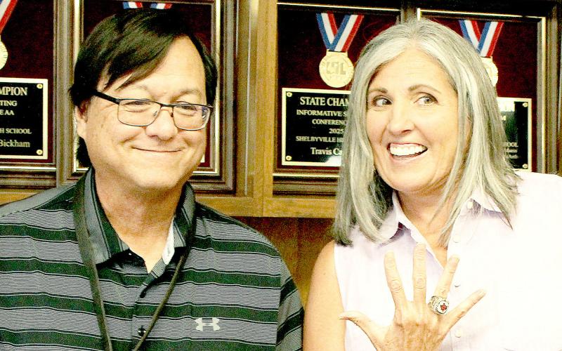 Etola Jones (right), Shelbyville ISD Board of Trustees president, along with Dr. Ray West, Superintendent, shows off the championship rings the district received for the high school’s 2025 triumph in state UIL competition. A ceremony was held last week in the board room to present the rings to all of the members and advisors of the UIL team. Submitted | Light and Champion