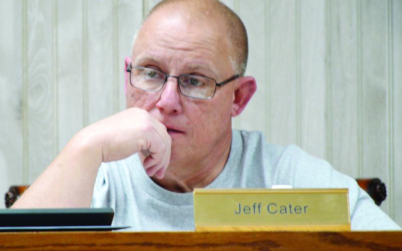 JISD board president Jeff Cater listens to a finance report from Joel Bumback at the board’s March meeting. Zack Clark | Light and Champion