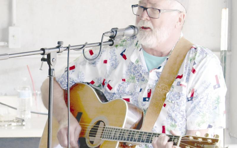 Center singer, songwriter Danny Paul Windham entertained the shoppers at Center Farmers Market inaugural event Saturday. Not pictured is his wife, Sally, who was also present to accompany him.