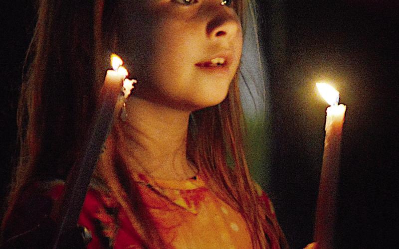The innocent wonder in a child’s eyes best captures the inspiration found in the Nativity Story as it was presented at the Christmas Eve candlelight service held on the Center square last Tuesday. David Danley | Light and Champion