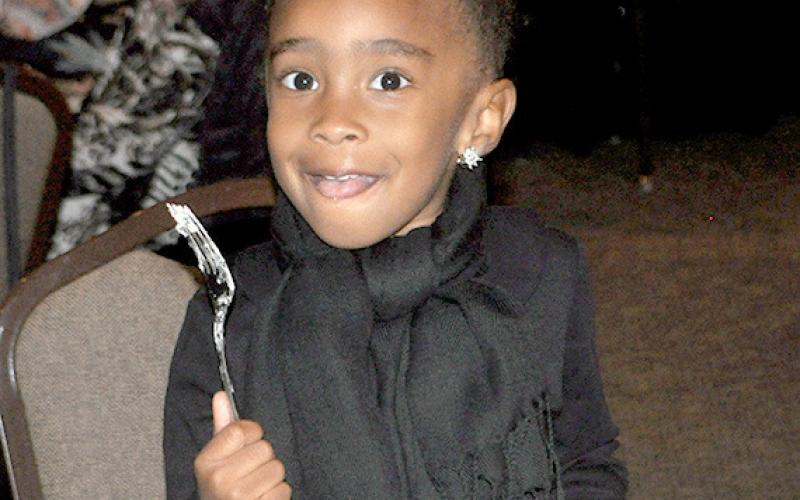 Not just for adults, this little one is enjoying dinner with her family at the 2024 Shelby County Chamber Awards banquet. Photo By Dennis Phillips