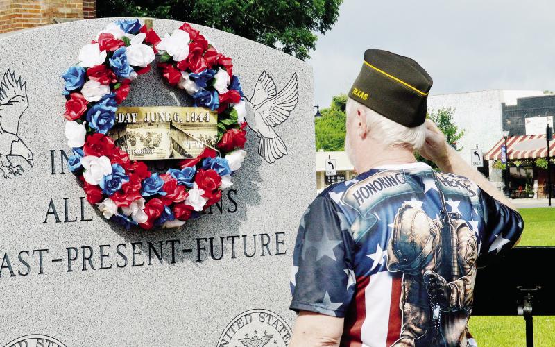 Members of VFW Post 8904 lay a wreath on the Shelby County Veteran’s Memorial on the grounds of the historic Shelby County courthouse in honor of D-Day. Zack Clark | Light and Champion