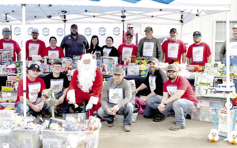 Santa poses with the KSW crew during the company’s first annual toy drive. Zack Clark | Light and Champion