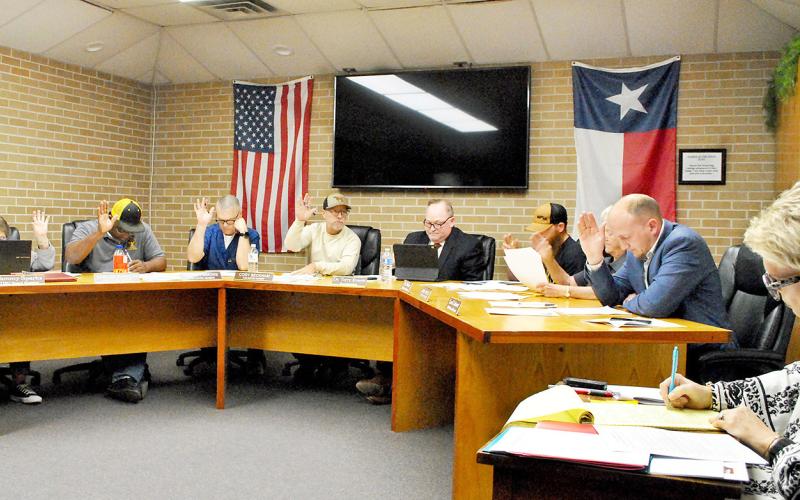 The Timpson school board takes a vote during its February meeting. Maggie Vaughn | Light and Champion