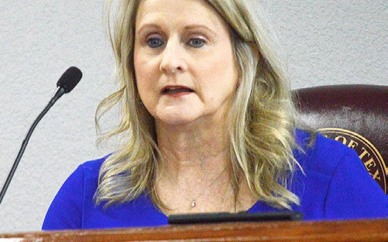 Shelby County Judge Allison Harbison informs the commissioners court of funds which the county is set to receive to upgrade its radio system. Zack Clark | Light and Champion